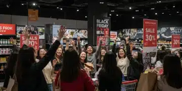 Shoppers eagerly engaging with Black Friday 2025 deals in a busy retail store.