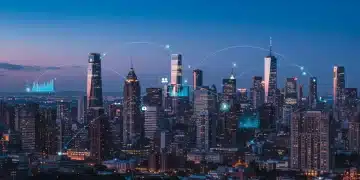 Futuristic cityscape with digital overlays representing US digital transformation